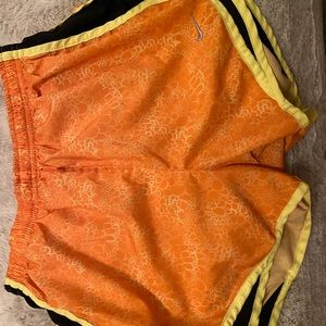 Orange Nike Dri-Fit shorts